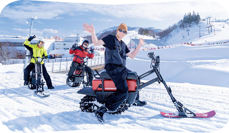 GALA Yuzawa snow bike experience with riders on tracked snow vehicles at Japanese ski resort
